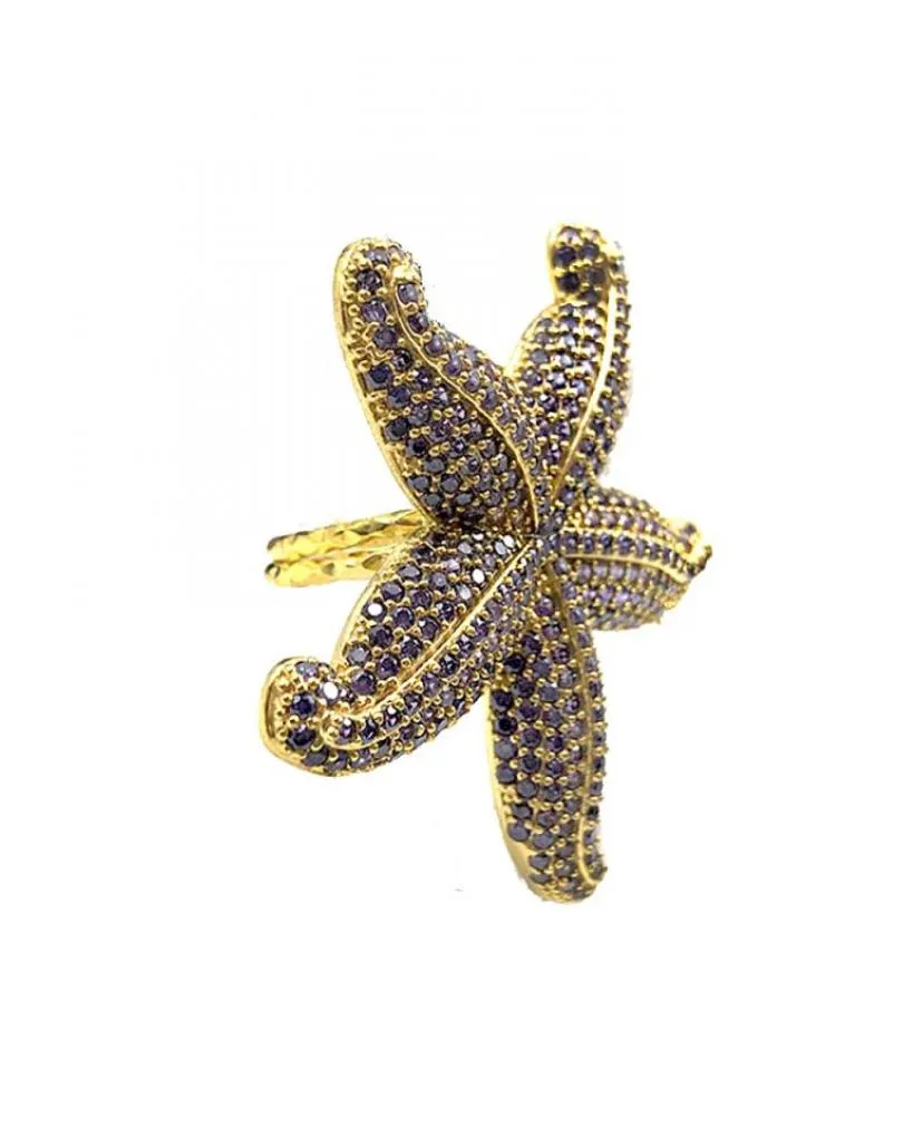 ANILLOS MORADOS DE ESTRELLA DE MAR DECORADA CON PEDRERIA