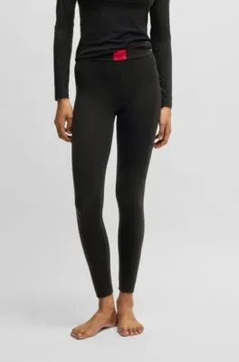 Leggings térmicos con etiqueta con logo roja