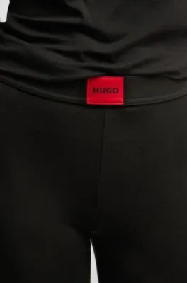 Leggings térmicos con etiqueta con logo roja
