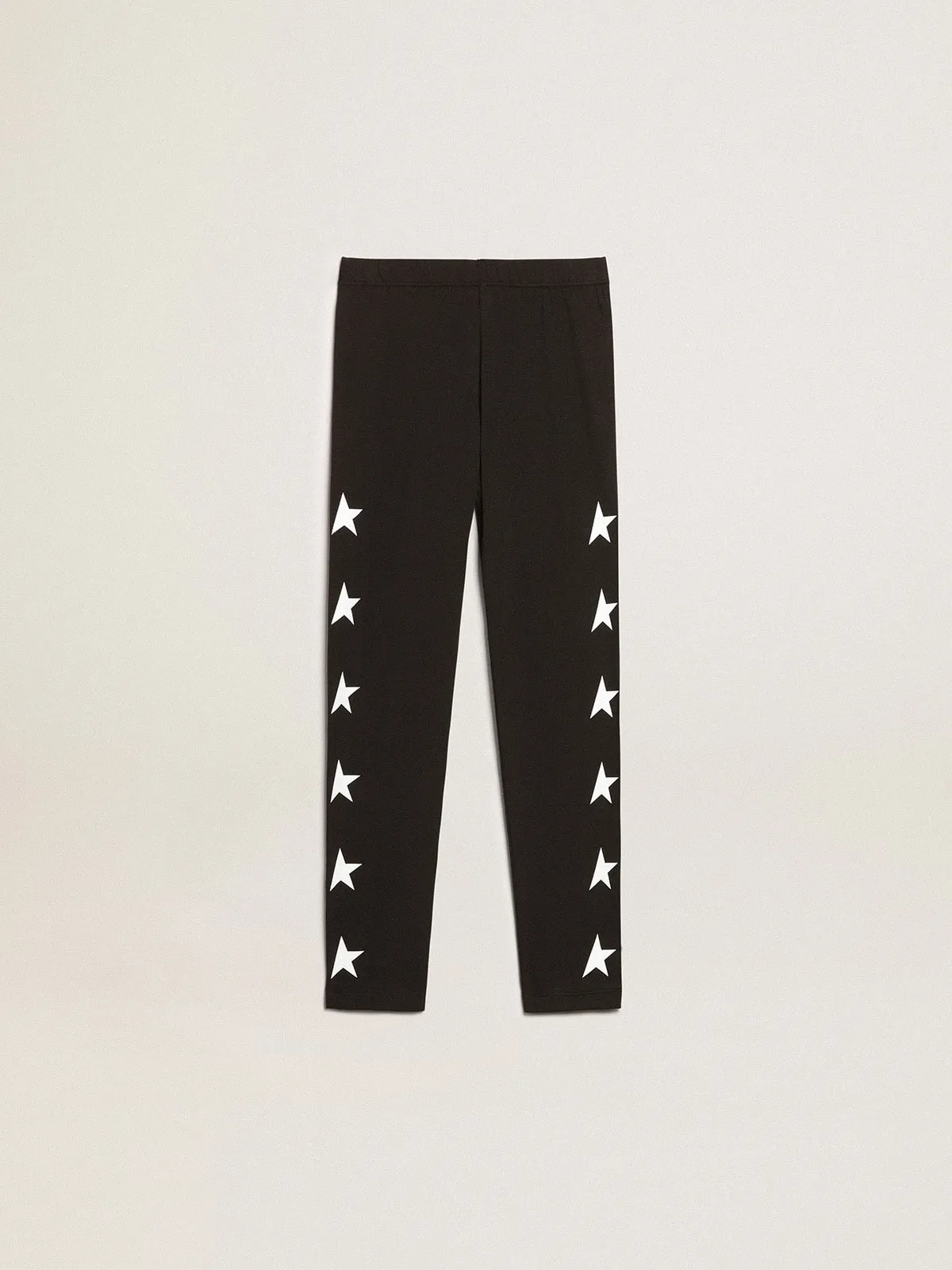 Pantalón leggings de color negro de niña con estrellas blancas en los lados