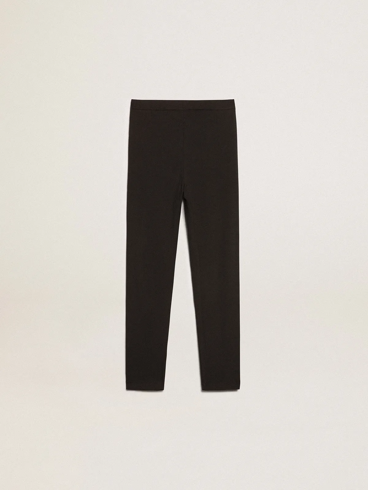 Pantalón leggings de color negro de niña con estrellas blancas en los lados